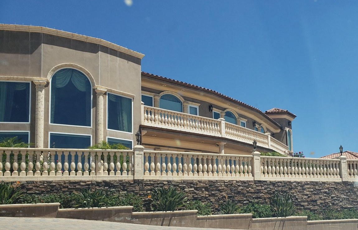 Big glass, big rooms, big loads: a large Mediterranean-style estate in Southern California. Today, Title 24 covers the heating and cooling in homes like this.