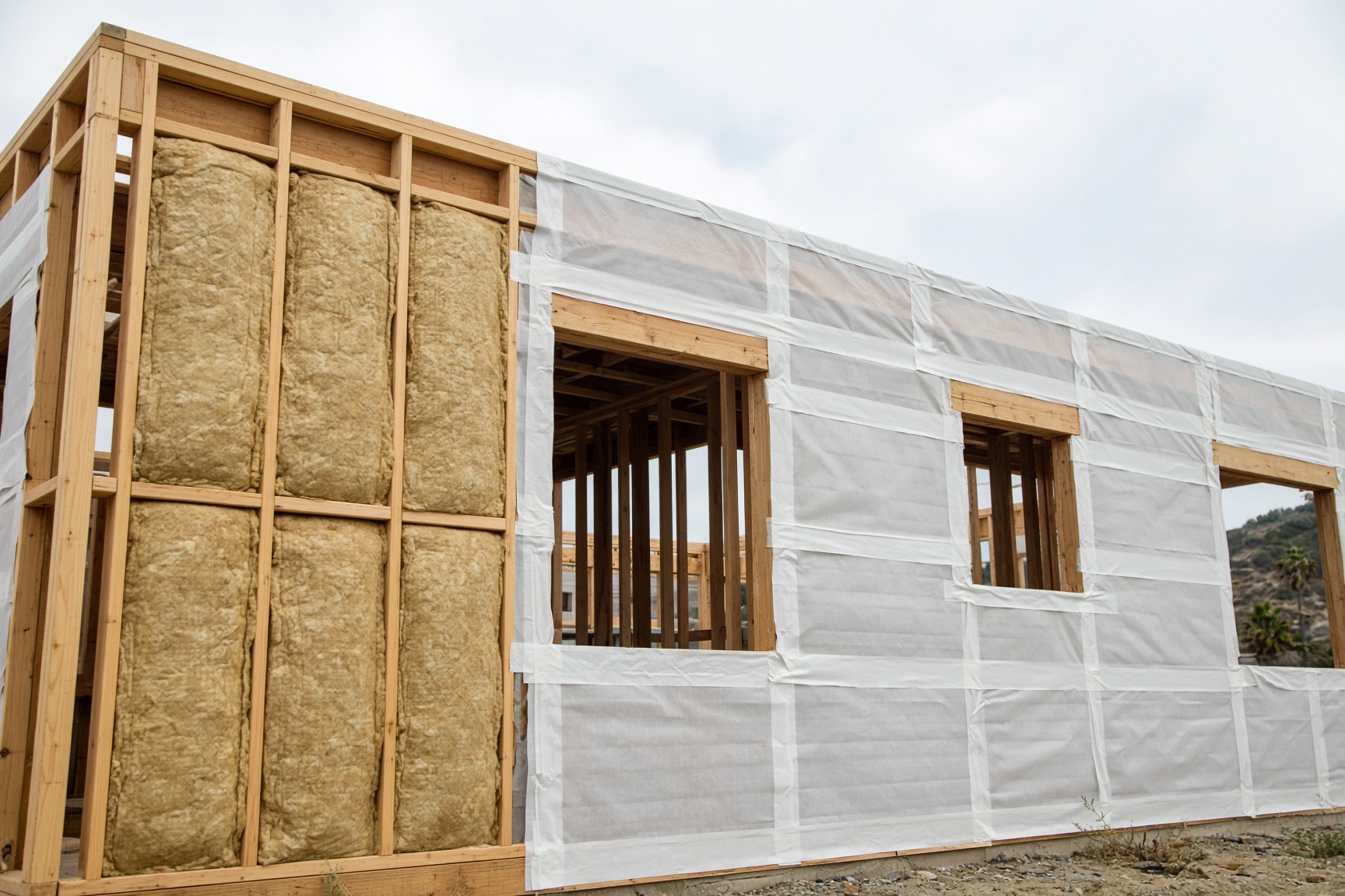 High-performance insulation and air-sealing details on a Southern California wood-frame house under construction